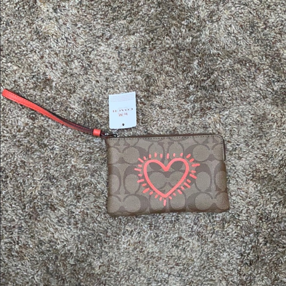 NWT Coach wristlet with orange heart design